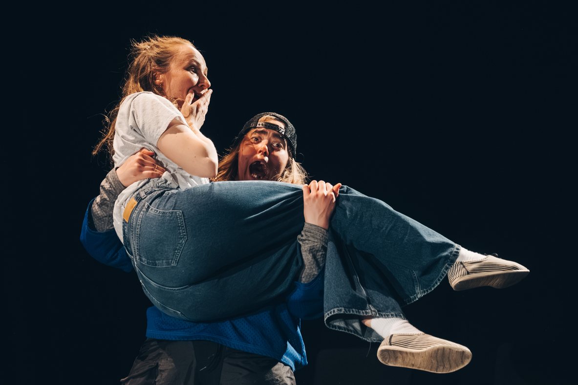 An ImprovAIsed performer lifting another performer during a FinFringe scene