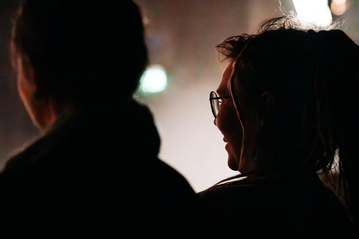 A silhouetted audience member watching ImprovAIsed at FinFringe