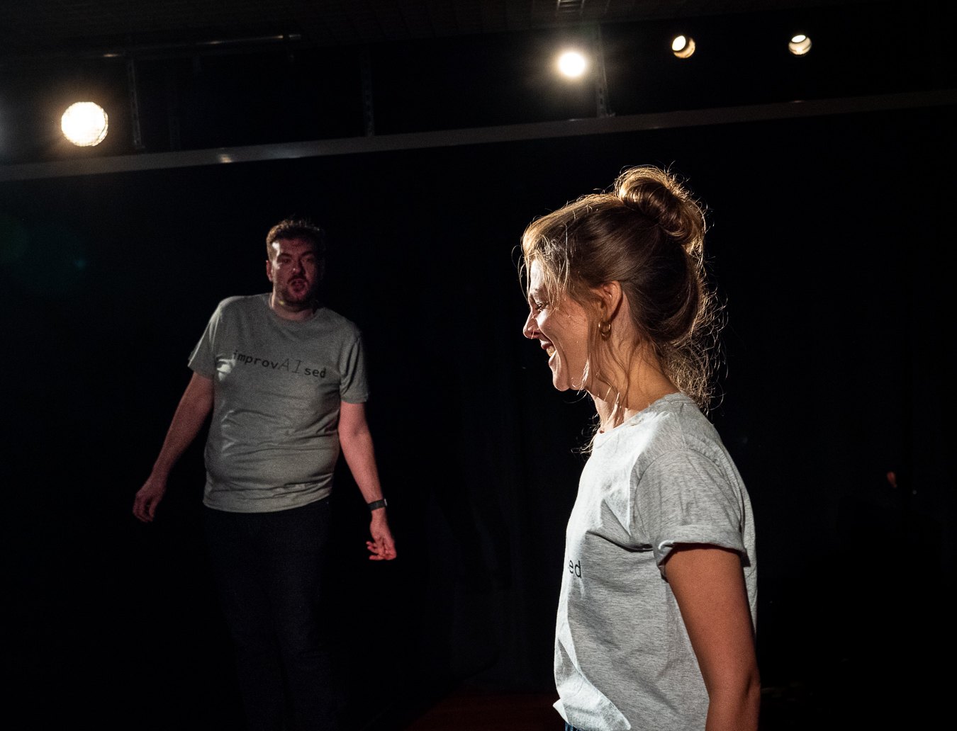Emily Matthews laughing during an ImprovAIsed performance